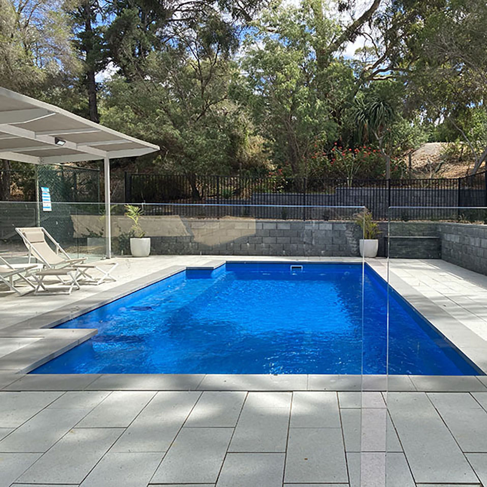 After Stoneware White Sands pool paving and Retaining Walls